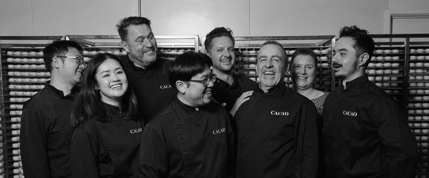 Black and white group photo of CACAO Chocolates & Macarons leadership team