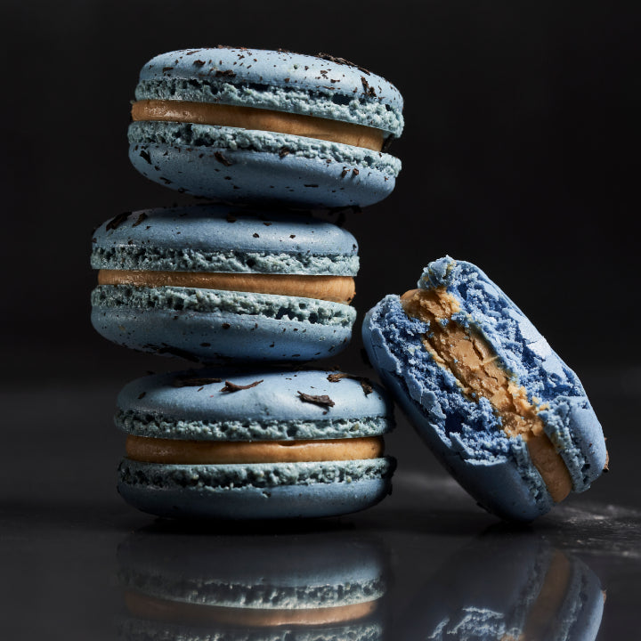 A stack of sky blue macarons with French Earl Grey infused caramel buttercream filling