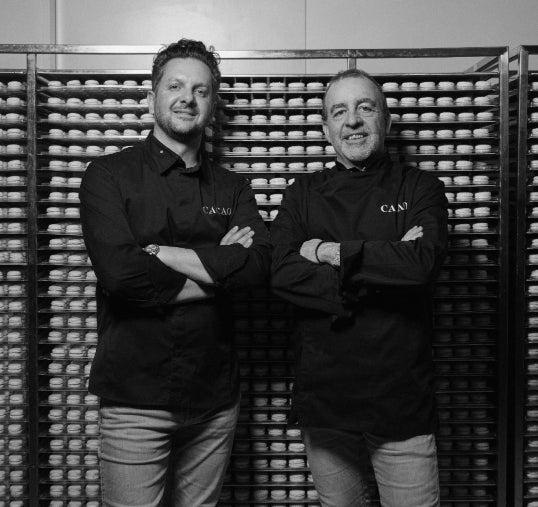 black and white photo of Tim Clark and Laurent Meric, owners of CACAO 